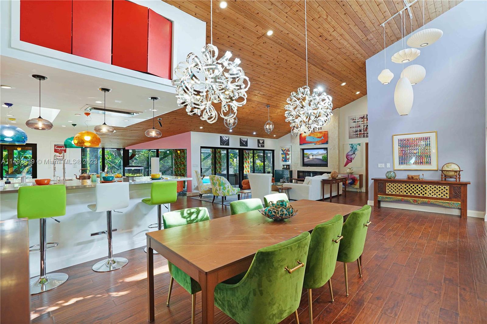 A Unique Find! Over 4,000 sq feet 5 bedrooms retreat nestled in a serene oasis on a quiet cul-de-sac. Extensively remodeled & reimagined by the current owner/designer to include the perfect balance between nature & modern luxury. 14'+ vaulted cedar ceilings in the social areas surrounded by impact glass walls, a gourmet state-of-the-art kitchen w/2 long cooking islands encasing a multitude of gas & electric premiere appliance that will impress the most discerning chef. 2 generously sized en suite bedrooms: 1 primary & a 2nd for extended family. All bedrooms are sanctuaries of relaxation & the baths of showroom style.A tropical patio/pool/summer kitchen area is enormous. Hidden features: 500 gal propane tank, EV charging station, gas hook-up for future generator, & boat/RV canopy. MUST SEE!
