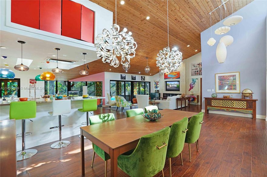 A Unique Find! Over 4,000 sq feet 5 bedrooms retreat nestled in a serene oasis on a quiet cul-de-sac. Extensively remodeled & reimagined by the current owner/designer to include the perfect balance between nature & modern luxury. 14'+ vaulted cedar ceilings in the social areas surrounded by impact glass walls, a gourmet state-of-the-art kitchen w/2 long cooking islands encasing a multitude of gas & electric premiere appliance that will impress the most discerning chef. 2 generously sized en suite bedrooms: 1 primary & a 2nd for extended family. All bedrooms are sanctuaries of relaxation & the baths of showroom style.A tropical patio/pool/summer kitchen area is enormous. Hidden features: 500 gal propane tank, EV charging station, gas hook-up for future generator, & boat/RV canopy. MUST SEE!