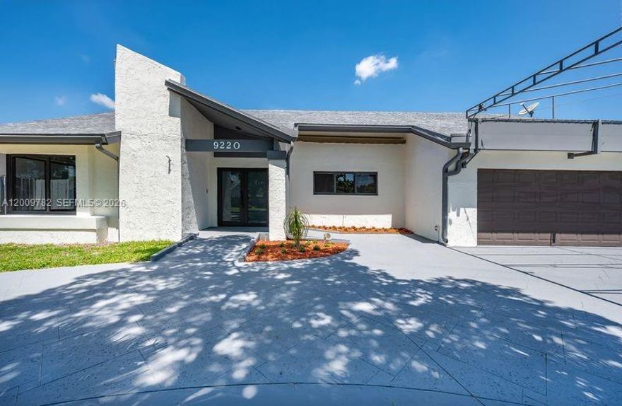 Completely redone very spacious 3 bed 2 bath with cathedral ceilings. Brand new impact windows, floors and
Kitchen cabinets with quartz counter tops.   S/S Appliances. A MUST SEE !!