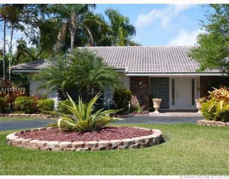 Great north Palmetto Bay home, featuring large impact door, new roof, new air conditioner, new accordion shutters and well manicured garden oasis.  Well appointed street, close to A rated schools! Walk to Starbucks and Baptist Urgent care, and 5 minutes from the Falls. Bring your remodeling skills and make this home your own.