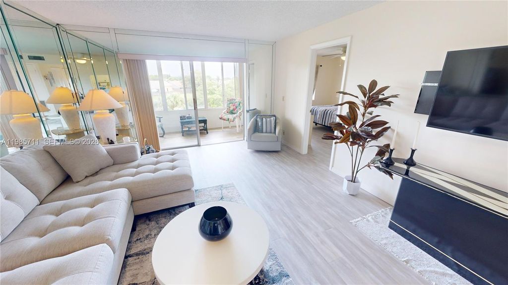 Photo of 9621 Sunrise Lakes Blvd #302, Sunrise, FL 33322 (MLS # A11985711)