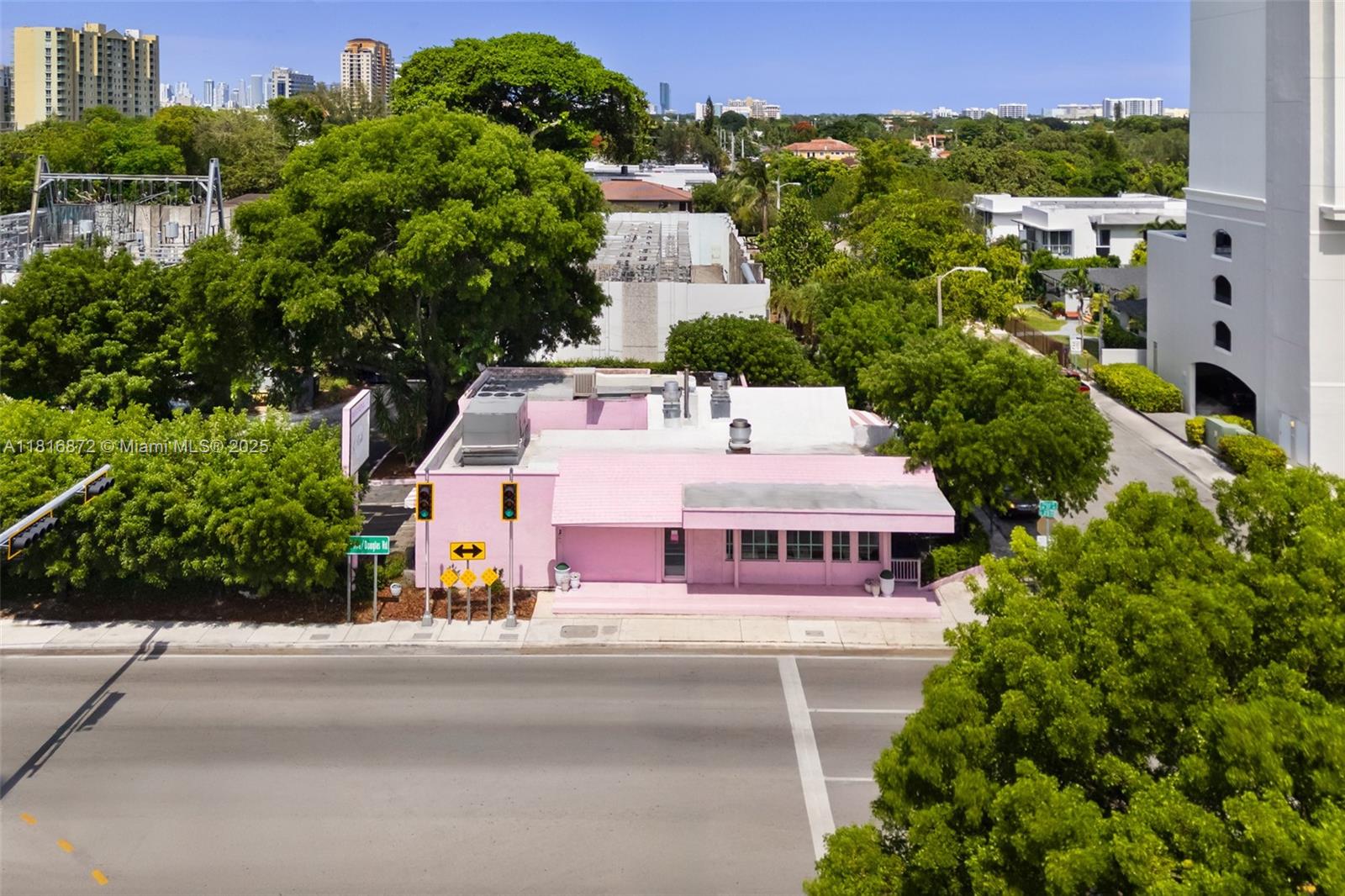 Exceptional opportunity to purchase a prime redevelopment site just steps from Coral Gables on a corner lot. Currently configured as a restaurant, the property is in excellent condition and offers flexible potential for retail, medical, office, or boutique residential use. The offering includes a 2,698 SF building, a 10,384 SF main lot, and a 5,700 SF adjacent parcel for parking. Located near Miracle Mile, Coral Gables Plaza, and the Loews Hotel, with superb walkability and close proximity to Brickell, Coconut Grove, MIA, US-1, and SR 836. Surrounded by condos, offices, and cultural amenities—this is a rare opportunity in a prime urban corridor.