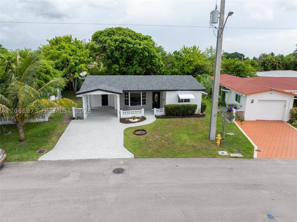 Photo of 4595 NW 43rd Ct, Lauderdale Lakes, FL 33319 (MLS # A12061973)