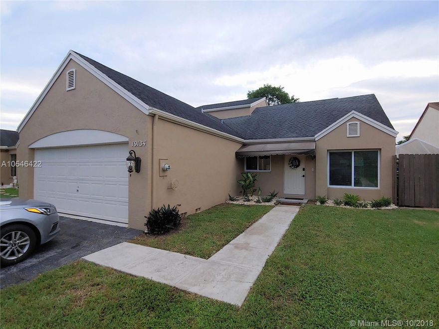 FURTHER REDUCED! Charming & cozy two-story 3 bedroom (master downstairs) and 2 bath home in Lakes of Avalon with 2 car garage. Roof was replaced in 2010. Washer & dryer inside garage. Hardwood bamboo and wood flooring as well as neutral ceramic tile throughout living areas.  Kitchen cabinets are solid wood. Tiled & glass backsplash. S/S appliances & granite countertops. Mounted microwave & oven. Concrete flooring added to patio area. HOA maintains lake area and is only $95 fee per month. Entire home just freshly painted on the outside. All windows and sliding glass doors hurricane impact proof. Thermo regulated windows which absorb heat so the house does not get hot. Only pre-approved buyers please! If cash buyer, POF required. Will not last!