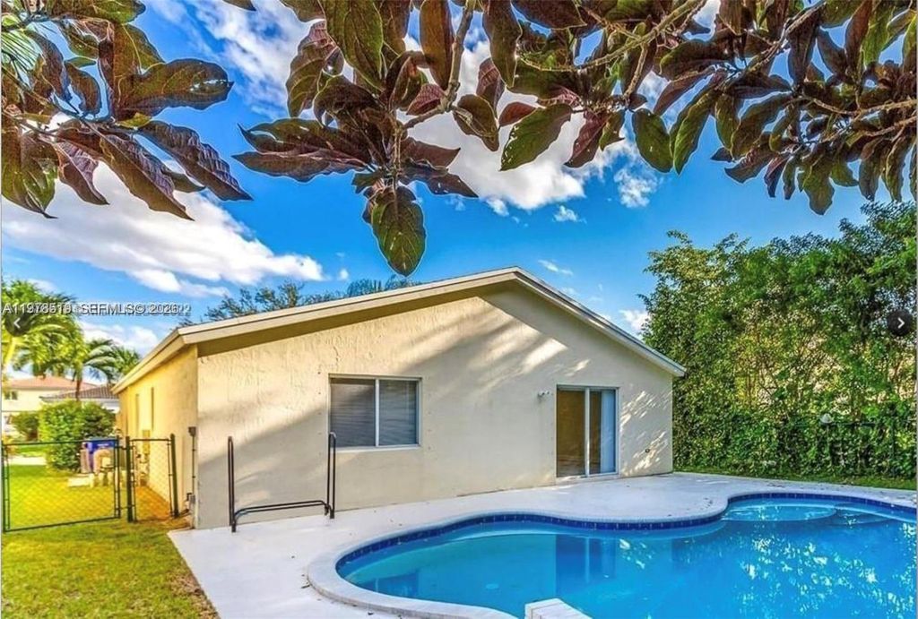 Photo of 1213 SW 46th Way, Deerfield Beach, FL 33442 (MLS # A11978519)