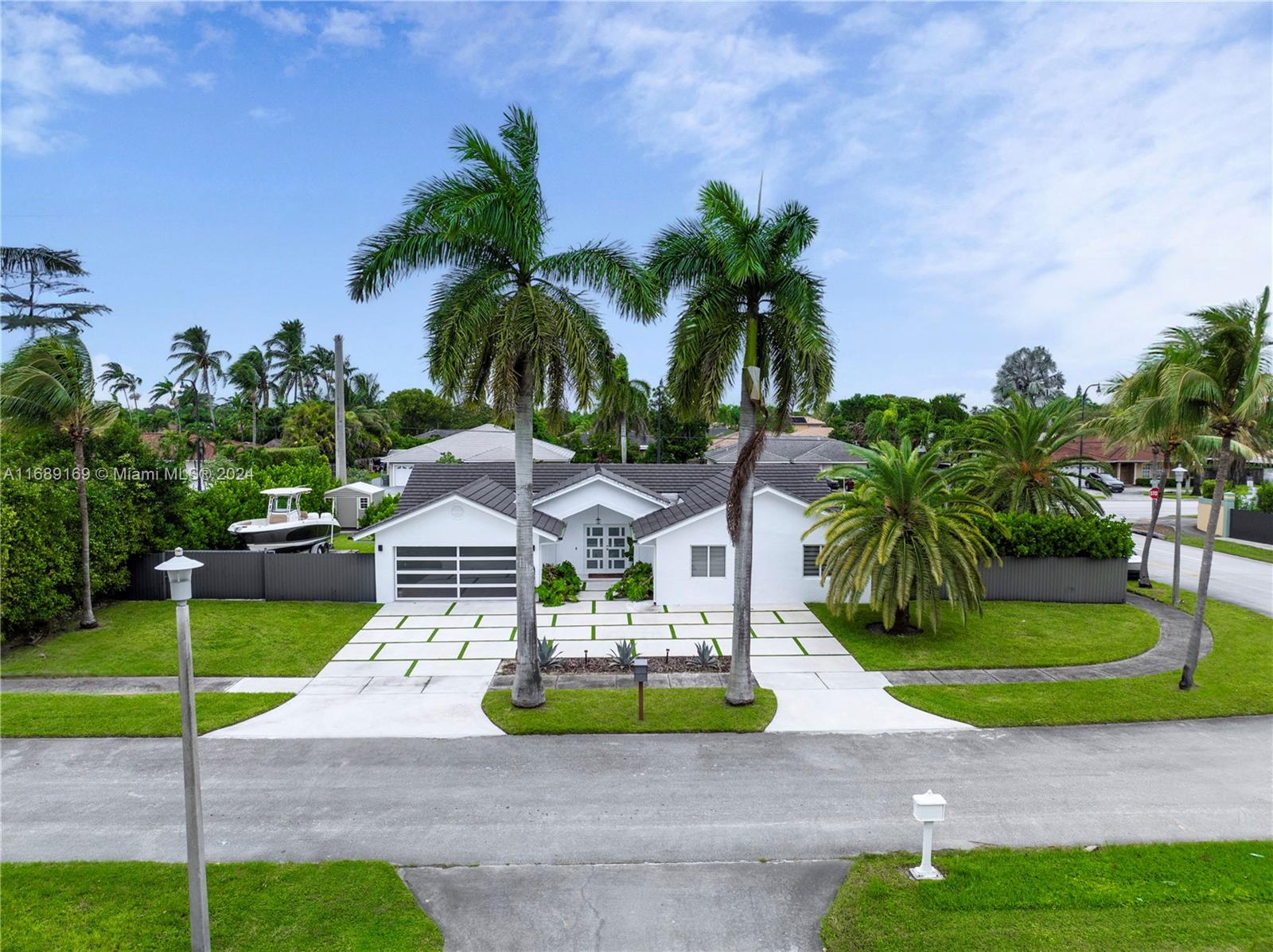 Beautiful newly remodeled 4/2 bath corner home on a .35 acre lot. Plenty of parking and large backyard.
Mayor remodel in 2021, new tile roof, new bathroom, new kitchen, new floors.
All new impact windows and doors, and driveway in 2022. New AC and modern vents 2024. New Garage Door 2024. Move in condition! Do not miss this amazing opportunity.