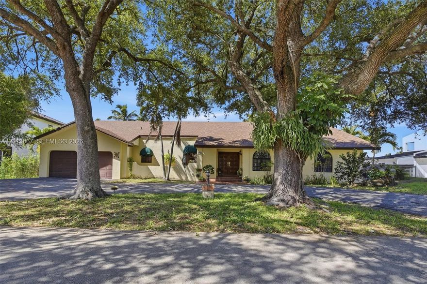 Beautifully situated on a lushly landscaped lot with tranquil golf course views, this spacious residence offers the perfect blend of comfort, character, and South Florida living. Expansive living areas are filled with natural light and seamlessly connect to the outdoor patio and pool, creating an ideal setting for entertaining or relaxing in privacy.  Generously sized secondary bedrooms provide flexibility for guests, family, or office space. Outdoors, enjoy a sparkling pool, covered terrace, and mature greenery that create a true backyard oasis. Additional features include a circular driveway, ample parking, and flex spaces. Conveniently located near shopping, dining, parks, and major roadways, this property offers exceptional space, privacy, and lifestyle appeal.