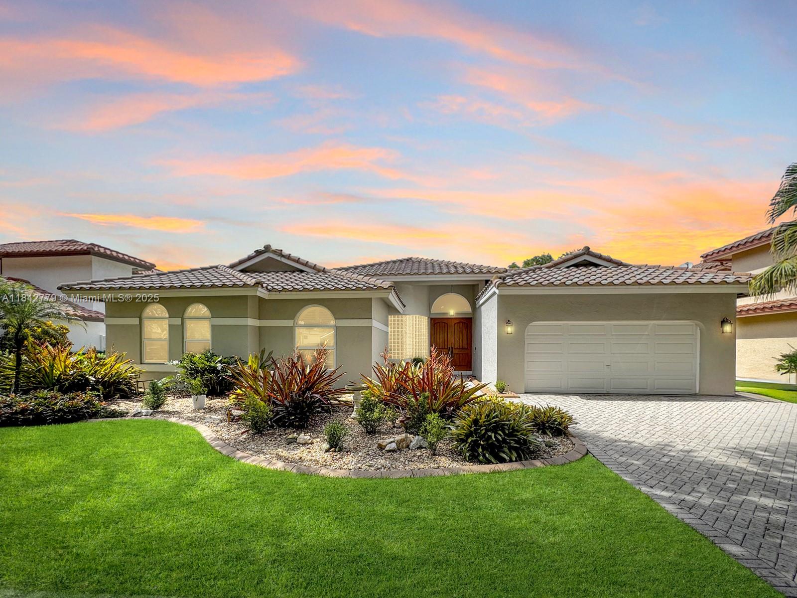 Beautiful 4 bed, 2.5 bath home nestled in the sought-after Embassy Lakes, Cooper City. Grand double door entry welcomes you to home filled with natural light through arched windows that create an inviting atmosphere. Kitchen features white cabinetry, granite tops, stainless appliances, counter-height seating & breakfast area. Open-concept layout w split floor bedroom plan. Spacious primary suite w walk-in closet & en-suite bath. Combination of impact & accordion shutters for complete protection; EV charger. Private Zen-like garden w stone pathway on fenced backyard with a tranquil covered patio retreat. Located on a tree-lined street in a pet-friendly neighborhood assigned to Cooper City schools. Resort-style gated community w fabulous pool, clubhouse, gym, sports courts & 3 manned gates.