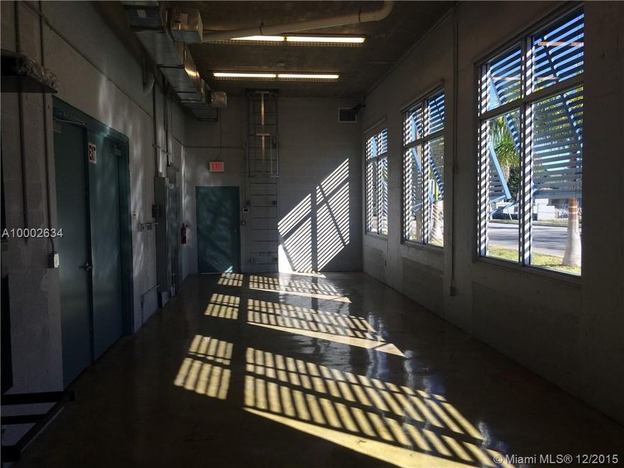 Originally designated as Trolley Station for City of Coral Gables - Never used or occupied.
INTERIORS:  Waiting & Reception Area,  2 Office Rooms, Kitchen, Shower Room & 2 Restrooms, Storage Room/Total of 2130 sq. ft 
ALL under A/C with Impact Windows. Main Room-6774 sq. ft under A/C with 9 bay-doors (18'high). 
EXTERIOR:  Back Parking Area - Gated and Monitored. Currently-14 parking spaces that could be expended to 26 if necessary.