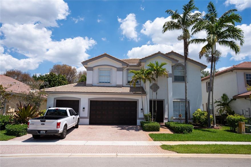 Sunset Falls gated community in Miramar. Features include oversized living areas, a full bedroom and bath downstairs, and a spacious primary suite with an extra room ideal for an office or nursery. Enjoy a private backyard with a beautiful pool, perfect for entertaining. Sunset Falls offers resort-style amenities including a pool, gym, tennis and basketball courts, park