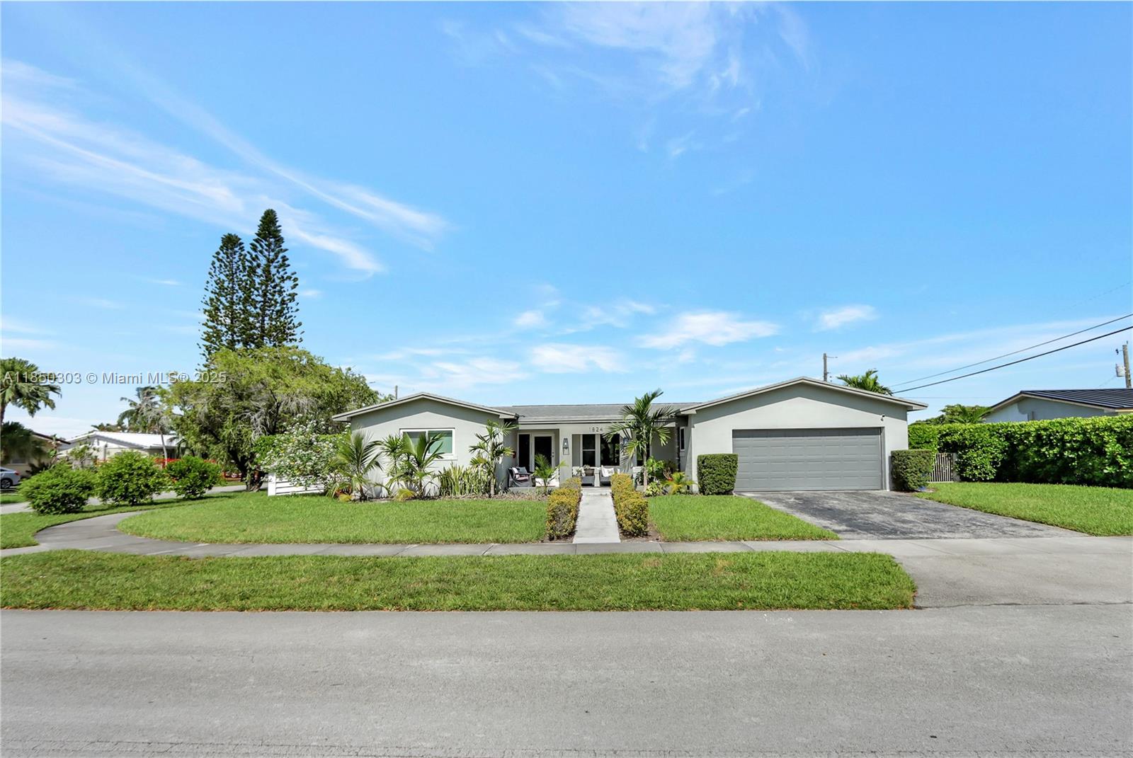 Welcome to this beautifully remodeled gem in the heart of highly sought-after Westchester! Situated on a spacious corner lot, this home perfectly blends style, comfort, and functionality. Step inside to discover an open-concept kitchen featuring elegant white wood cabinetry, sleek quartz countertops, and rich wood flooring that flows throughout the living spaces. Enjoy peace of mind with hurricane impact windows and doors, while two A/C units ensure year-round comfort. The generously sized bedrooms offer ample space and natural light, complemented by tastefully remodeled bathrooms. A dedicated laundry room and a two-car garage add to the home’s convenience. Step outside to your private oasis—an updated pool with salt water chlorination and a heater, perfect for year-round enjoyment.