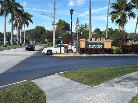 Photo of 7120 S Devon Dr #110, Tamarac, FL 33321 (MLS # A11938956)