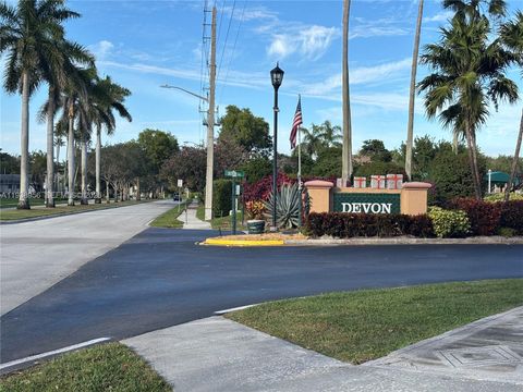 Photo of 7120 S Devon Dr #110, Tamarac, FL 33321 (MLS # A11938956)