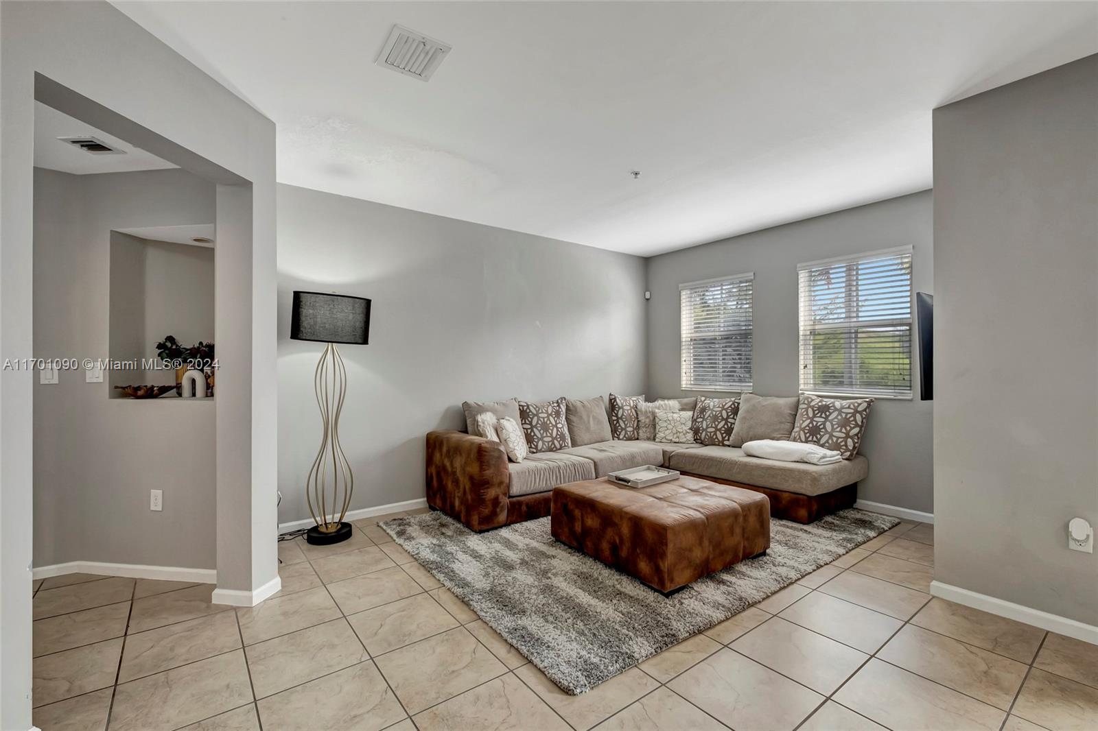 Discover this stunning two-story apartment in St. Maarten at Grand Bay! The first floor boasts an open-concept kitchen, dining, and living area, complemented by a convenient guest bathroom. Enjoy modern touches with stainless steel appliances, granite countertops, and a full-size washer/dryer in the unit. Upstairs, you’ll find two spacious bedrooms, both en-suite with fully remodeled bathroom.
Located in a well-maintained gated community with 24/7 security, residents enjoy resort-style amenities, including a community pool with water park, game room, tennis and basketball courts, a gym. Perfectly situated near Ronald Reagan Turnpike, Palmetto Highway, and Miami International Airport, this property offers the ultimate in comfort and convenience.