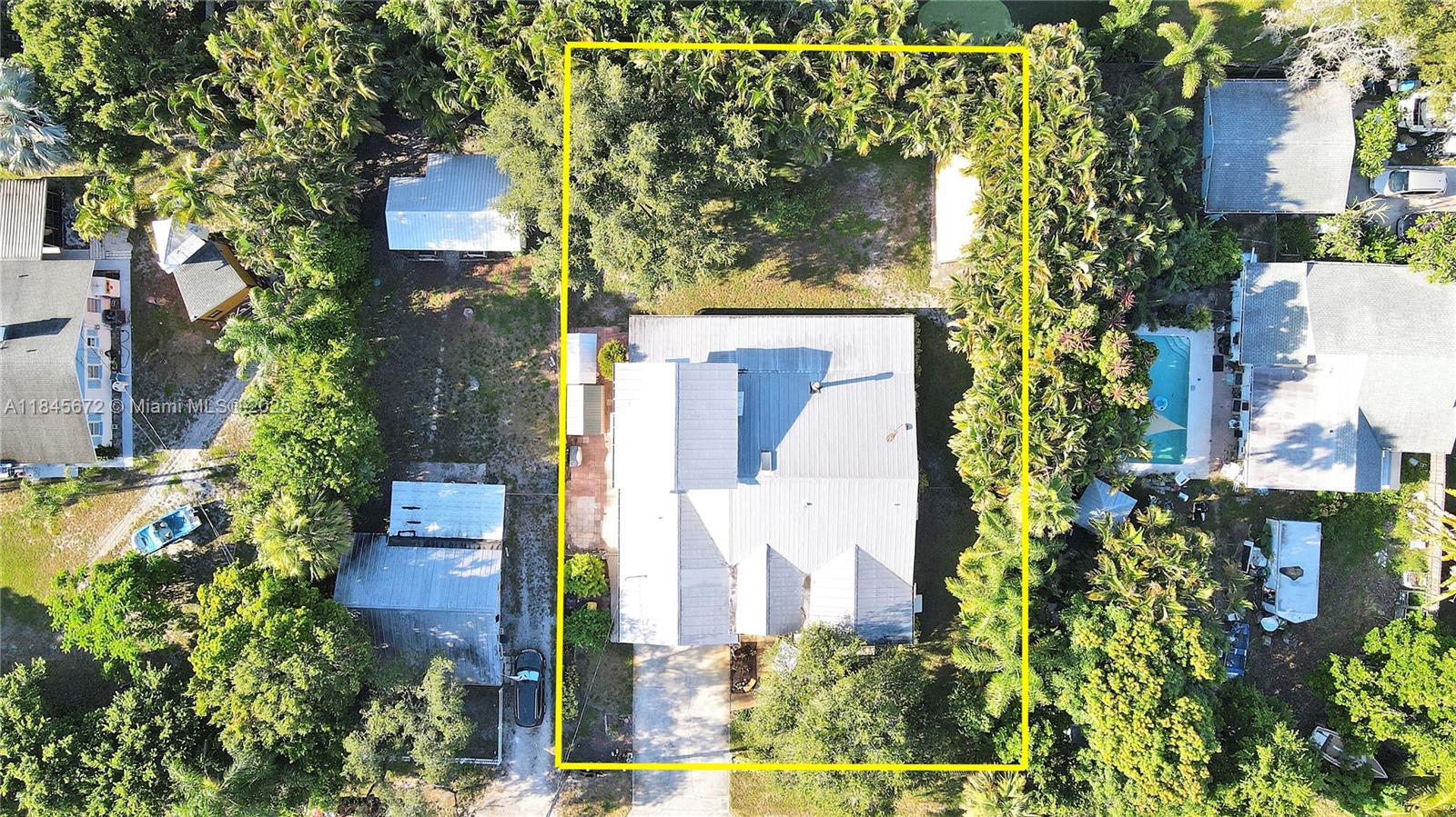 Charming Palm City Home W/ In-Law Suite. Lovingly cared for 4B/R, 3.5 B, 2car garage. Nestled on a double lot, features a separate-entry in-law suite or potential rental—ideal for multi-generational living or added income potential. Offering a metal roof, two newer A/C units, updated appliances, and LV wood flooring, kitchen has full pull-out cabinetry, wood-burning fireplace. Extras- an attic fan, 4-zone sprinkler system (city water + well for irrigation), & ample boat/RV parking. Explore the vibrant Palm City lifestyle, short stroll to the brand-new park offering free community events & concerts. Families will appreciate the highly rated schools w/ parental involvement, close proximity to boat ramps & athletic fields. Home ready to continue a legacy of love, laughter, & lasting memories.