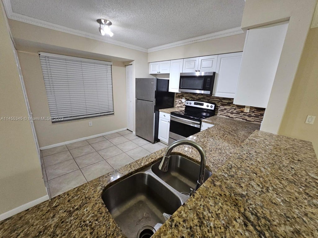 Photo of 1739 Village Blvd #111, West Palm Beach, FL 33409 (MLS # A11455345)