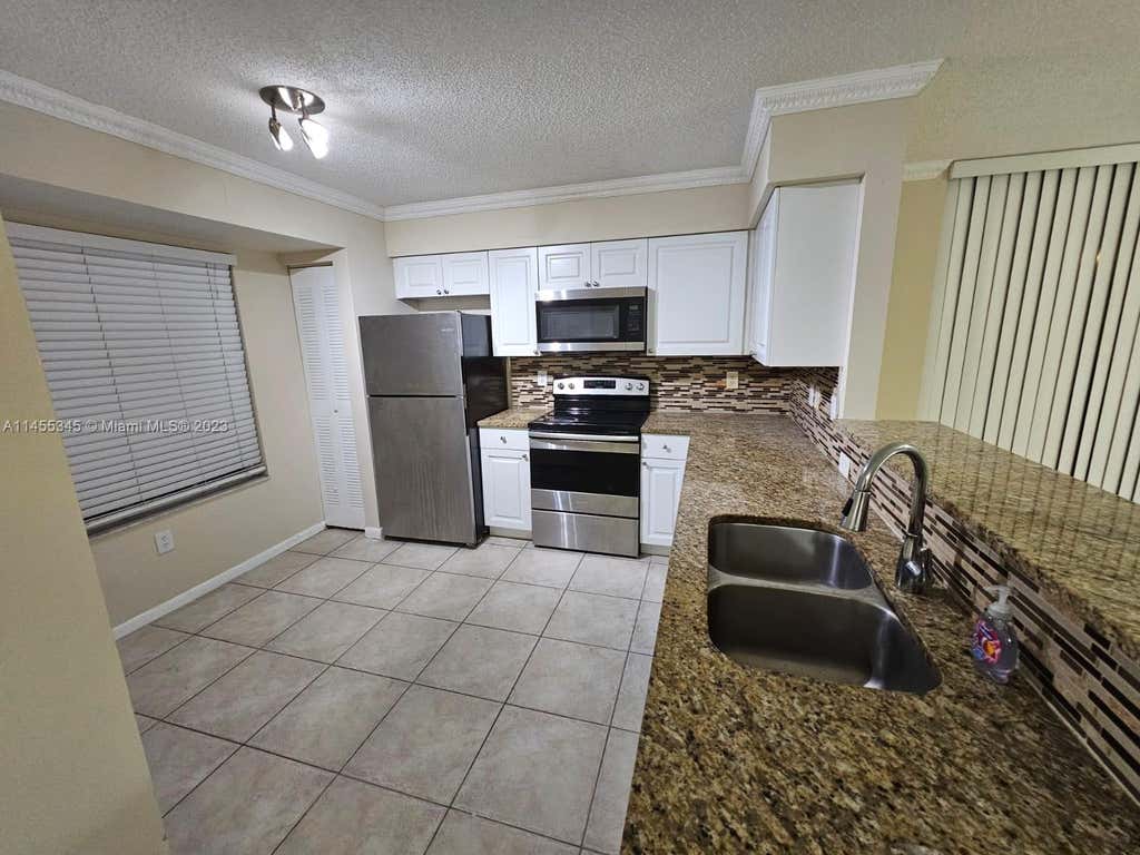 Photo of 1739 Village Blvd #111, West Palm Beach, FL 33409 (MLS # A11455345)