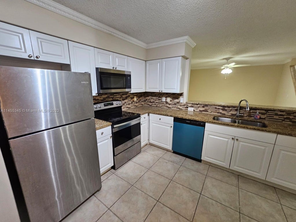 Photo of 1739 Village Blvd #111, West Palm Beach, FL 33409 (MLS # A11455345)