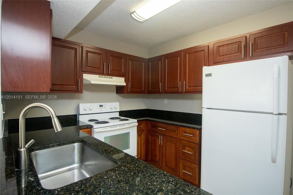 Photo of 9491 S Palm Cir S #101, Pembroke Pines, FL 33025 (MLS # A12014151)