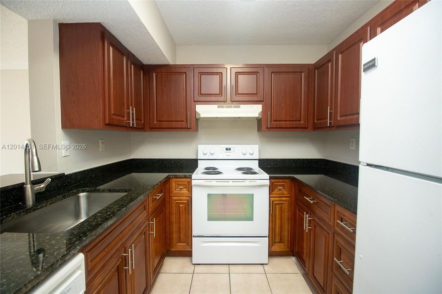 Ground-Floor Gem in the Heart of Pembroke Pines! Welcome to this bright and spacious 2-bedroom, 2-bathroom condo located in the beautifully maintained community of The Palms of Pembroke. This coveted first-floor unit features a welcoming open layout with seamless transitions between the living and dining areas—perfect for both relaxing and entertaining.

The primary suite serves as a true retreat, boasting a generous walk-in closet and an en-suite bath. Enjoy the convenience of an in-unit washer and dryer, neutral tile and laminate floors throughout for easy maintenance, and a private porch perfect for your morning coffee.

Residents of The Palms enjoy resort-style amenities, including a sparkling pool, fitness center, tennis courts, and a clubhouse. Strategically located just minutes from the Florida Turnpike and I-75, and a short drive to the premier shopping and dining at Pembroke Lakes Mall and Pembroke Gardens. Whether you are looking for a primary residence or a savvy investment opportunity, this unit is a must-see!