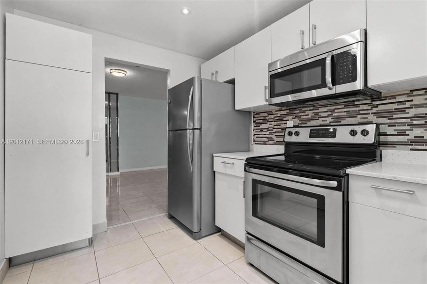 55+ Community. Spacious 2-bedroom, 2-bath, 1,192 sqft unit located on the second floor of a gated, lakefront community. Features include tile flooring, stainless steel appliances, a large living/dining area, an enclosed balcony with garden views, and one assigned parking space and storage space. The laundry room is just steps from the unit. Low maintenance fee includes water, internet, and cable. Conveniently located near I-95, Aventura Mall, and shopping centers. Easy access to public transportation, dining, and daily essentials.
