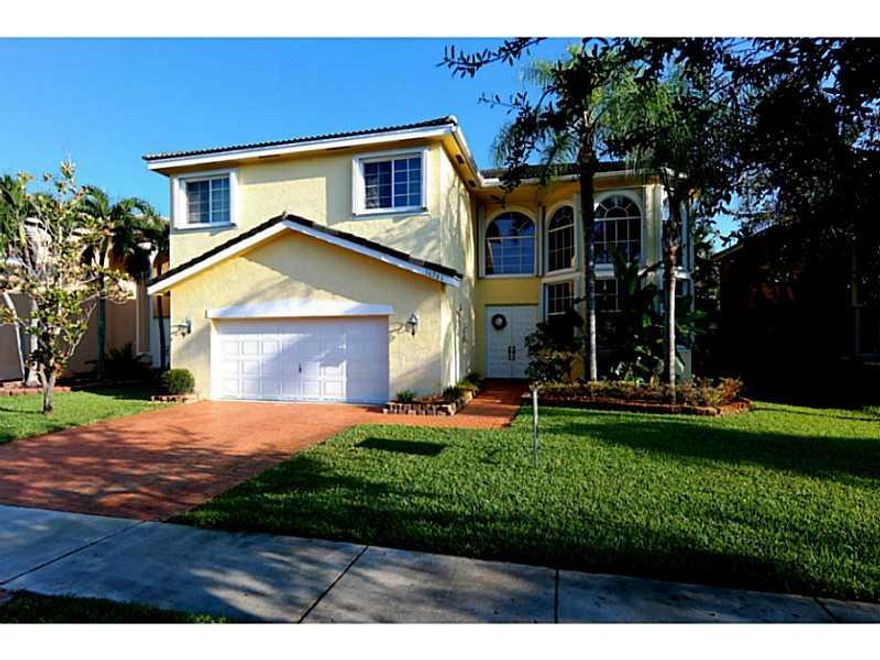 Spacious 2 story Ipanima model with POOL + SPA located in gated Pembroke Shores/Harbourside Estates. Upgraded kitchen w/ granite counter tops, stainless steel appliances+eat in kitchen/breakfast area that opens to an expansive family room. Step out from family room to the covered patio and private backyard oasis.Dining room and formal Living room have soaring 19+ foot ceilings.ACCORDION SHUTTERS and fenced in yard.Pool and landscaping maintenance inc!Professionally property managed!SHOWINGS BEGIN 12/12/15