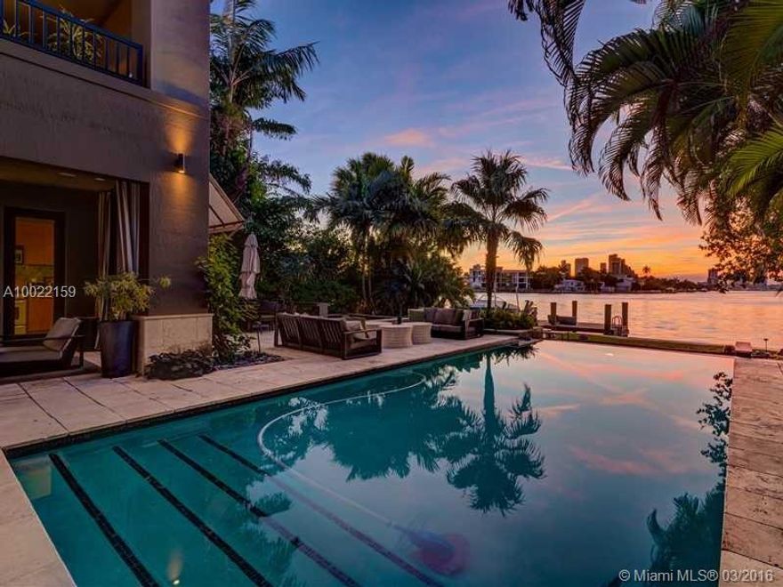 Contemporary home rebuilt in 2003 with classic interior design by Allen Saunders. Seven bed with eight and a half bath, luxurious master suite with his/her dressing rooms. Large living and dining room, adjacent chef's kitchen. Stunning westerly skyline & wide Bay views, negative edge pool, reflecting pools, hot tub, dock, beautiful terraces & outdoor seating areas + outdoor kitchen/bar/cabana bath. Easy to show.