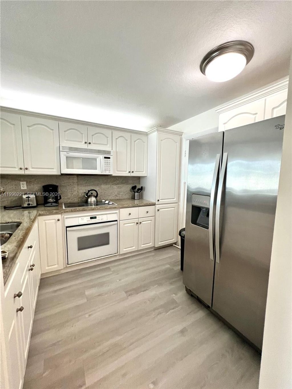 Photo of 8233 Harding Ave #204, Miami Beach, FL 33141 (MLS # A11990221)