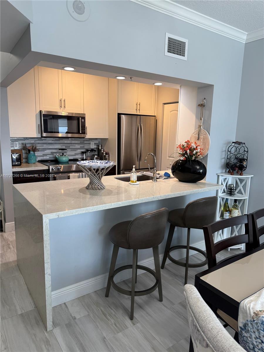 WOW - WOW- WOW!!!!! This GORGEOUS unit can not be missed!!!! From the kitchen that is just beautiful with 42" cabinets, quartz counter tops, stainless appliances, fabulous floors, beautifully redone bathrooms, not to mention the amazing views, this unit has it all!!!! Truly a turn key apartment that is just perfect!!! Enjoy all of the wonderful amenities that The Tides offers such as an incredible gym, tennis court, pool & hot tub overlooking the intracoastal & the ocean. Pet friendly building that the fur babies can ride in their own elevator. Walk to the beach, many restaurants, boutiques, cigar bar, coffee shops, bars and so much more. Enjoy hopping on the Water Taxi across the street. It really is the BEST place to call home in Ft. Lauderdale!!!! Being sold furnished or unfurnished.