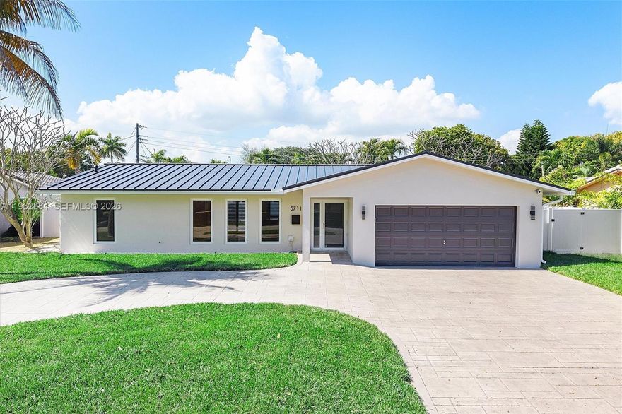 THIS BEAUTIFUL AND FULLY RENOVATED 3 BEDROOM/2 BATHROOM RESIDENCE WITH HEATED POOL OFFERS A SPLIT-PLAN DESIGN, WITH A PRIVATE SPACIOUS FAMILY ROOM THAT CAN EASILY BE USED AS A HOME OFFICE OR PLAYROOM. EVERYTHING BRAND NEW: GALVANIZED METAL ROOF & GUTTER SYSTEM, AC 3.5 TON W/ DUCTS, HIGHEST GRADE IMPACT WINDOWS & DOORS, ALL PVC PLUMBING, INCLUDING DRAINAGE, PORCELAIN TILE FLOORING THROUGHOUT, MODERN OPEN KITCHEN WITH THICK QUARTZ WATERFALL COUNTERTOP AND STAINLESS STILL  APPLIANCES, GORGEOUS BATHROOMS, MODERN LIGHT FIXTURES, SMART-HOME LIKE NEST THERMOSTAT, RING CAMERAS, RAIN-BIRD SMART IRRIGATION CONTROLLER, SEPARATE LAUNDRY ROOM WITH NEW WASHER/DRYER, PVC FENCED YARD,  DIAMOND BRITE HEATED POOL, LANDSCAPING, SPRINKLER SYSTEM, EXPANDED CIRCULAR CONCRETE DRIVEWAY, LARGE 2 CAR GARAGE WITH EPOXY FLOORING AND AUTOMATIC GARAGE DOOR OPENER. HOME SETS ON SPACIOUS LOT IN THE COLONIAL RIDGE, ESTABLISHED NEIGHBORHOOD KNOWN FOR ITS CHARM, TRANQUILITY, AND FAMILY-FRIENDLY ATMOSPHERE, NEXT TO DESIRABLE IMPERIAL POINT.JUST MINUTES FROM PINE CREAST SCHOOL AND WESTMINSTER ACADEMY, SHOPPING CENTERS, RESTAURANTS, BEACH.