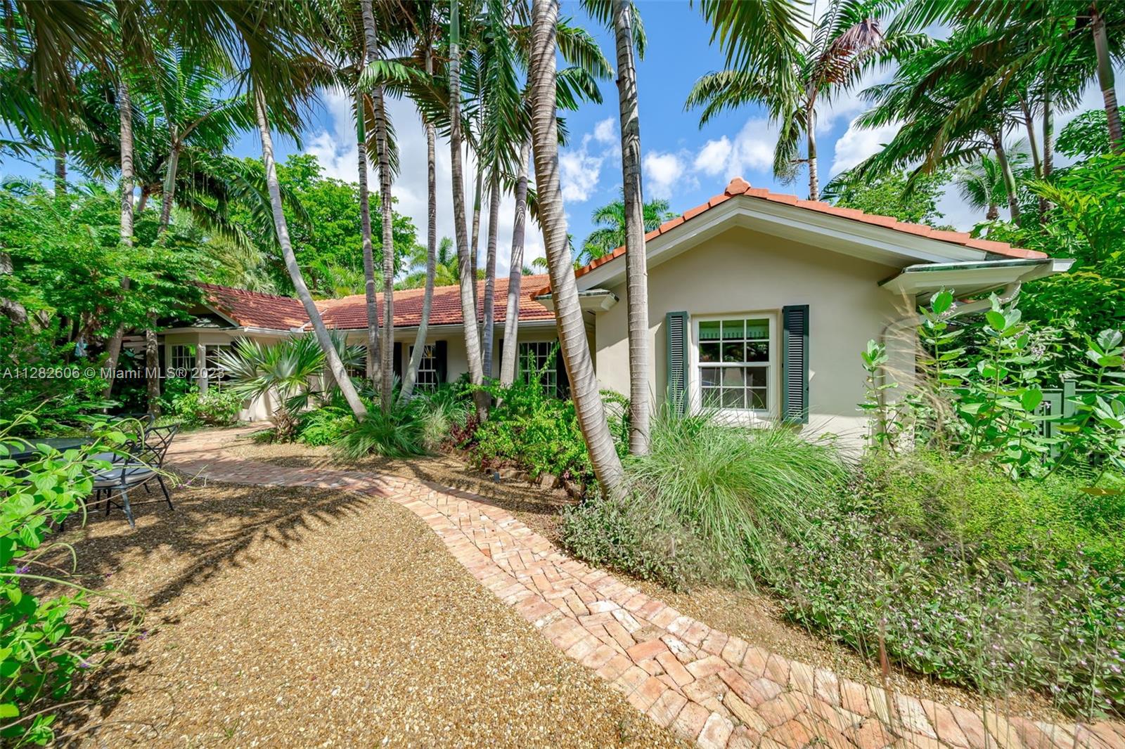 The historic private community of Ye Little Wood is an enclave of 31 luxury homes in desirable Coconut Grove. The property is set in a beautiful tropical landscaped lot, complete with a Zen garden and flowing fountain located outside the master suite. Elegant and spacious, this home offers a gourmet kitchen complete with an island, an adjacent breakfast room, large living/dining areas, den and laundry room. A spacious sunroom overlooks the lush pool area, outdoor dining space and jacuzzi. The property features a separate 2-story guest house with a large studio apartment, kitchen and full bathroom upstairs. The lower level features 1 bedroom and full bath, perfect for a maid’s quarters or pool room. Great opportunity to live in one of the most beautiful neighborhoods in South Florida!