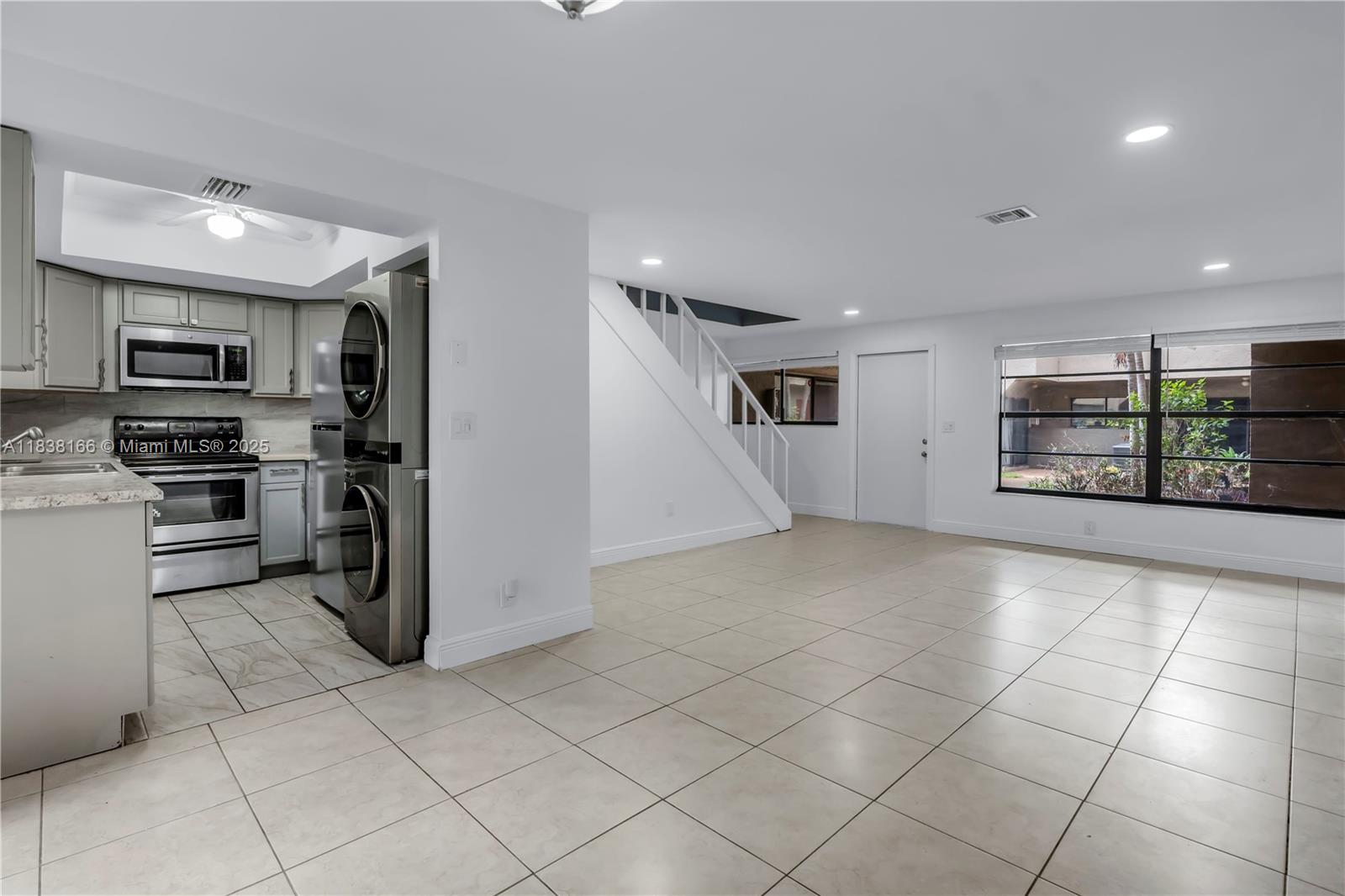 This updated Coral Springs gem offers the perfect blend of comfort, style, and location. Tucked in a quiet, family-friendly community just steps from Mullins Park and local schools, the home features a newly renovated kitchen with stainless steel appliances, modern finishes, and freshly painted cabinetry. You'll also enjoy brand new washer, dryer, and fridge units, making move-in a breeze. The main level includes tile flooring and a bright, clean feel, while upstairs you'll find two cozy bedrooms with ceiling fans, and spacious closets with shelving. Additional perks include a new A/C system, 2.5 bathrooms, access to a community pool, and a civic park right across the street! Everything you need for easy living in the heart of Coral Springs. 675+ credit score is required by HOA!