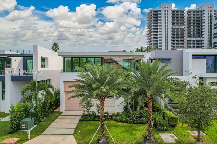 Discover elevated luxury living in the heart of the exclusive Venetian Islands. Tucked away on a quiet cul-de-sac, this exceptional 4-bedroom / 4.5-bathroom contemporary residence showcases sophisticated modern design, premium finishes, and effortless indoor-outdoor living. Thoughtfully designed for both comfort and entertaining, the home features a stunning Italian chef’s kitchen equipped with top-of-the-line appliances, sleek custom cabinetry, and designer built-ins throughout. Expansive living spaces are filled with natural light, creating a seamless blend of elegance and warmth. The private 2-car garage plus a car lift for added convenience and luxury. Above it all, the expansive rooftop terrace offers breathtaking 360-degree views of Biscayne Bay and the Miami skyline — an unforgettable setting for entertaining, sunset gatherings, or quiet relaxation. Ideally located just minutes from Miami’s world-renowned beaches, Sunset Harbor, Edgewater, and the Design District, this residence offers the perfect balance of privacy, sophistication, and access to the city’s best dining, shopping, and nightlife.