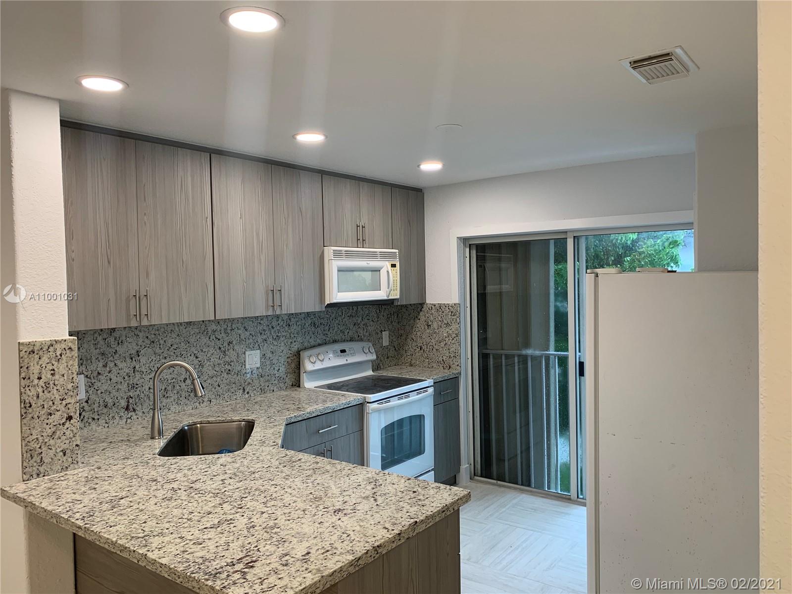 Totally brand new remodeled unit. 3 Bedroom 2 Bath plus mezzanine for office space. 2 Parking Spaces in front of unit. Brand new kitchen lots of illumination throughout. Rent includes water. Excellent location in Doral. Easy to show, call listing agent.