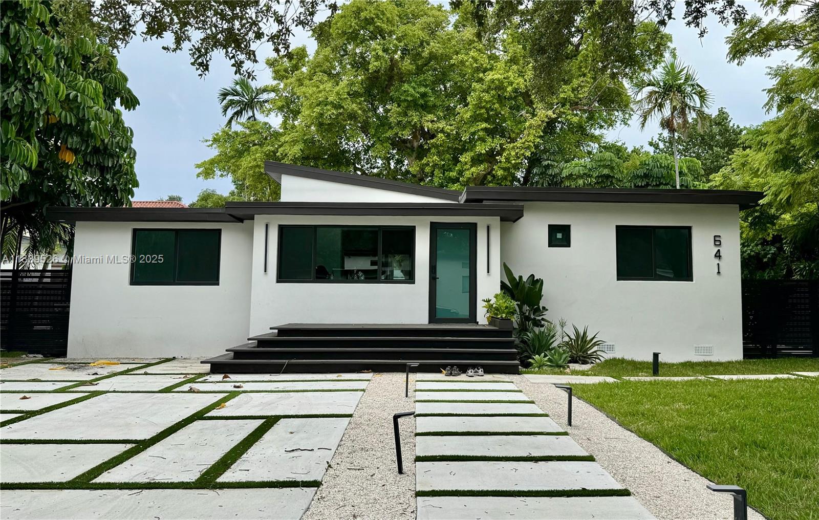 Brand new 4BD/4BA home – never lived in! 1,850 SF of living space + 1,000+ SF of decks & 490 SF covered area w/ full summer kitchen.
Impact windows/doors, new roof, plumbing, electrical & insulation.
High-end finishes throughout, floors & doors w/ invisible hinges, new kitchen, baths & extraordinary laundry.
New driveway fits 8 cars. Landscaped yard w/ Jacuzzi (7+), fire pit & playground. Primary suite w/ private terrace & outdoor tub, accessed from bedroom & shower. Extra space w/ private entrance & driveway – ideal as an efficiency or office
Smart Home Features:
iPad control panel, Alexa/Echo, smart lighting, switches, outlets, thermostat, appliances, washer/dryer, irrigation, and front door lock with cameras.
Truly a modern masterpiece offering privacy, luxury, and flexibility.