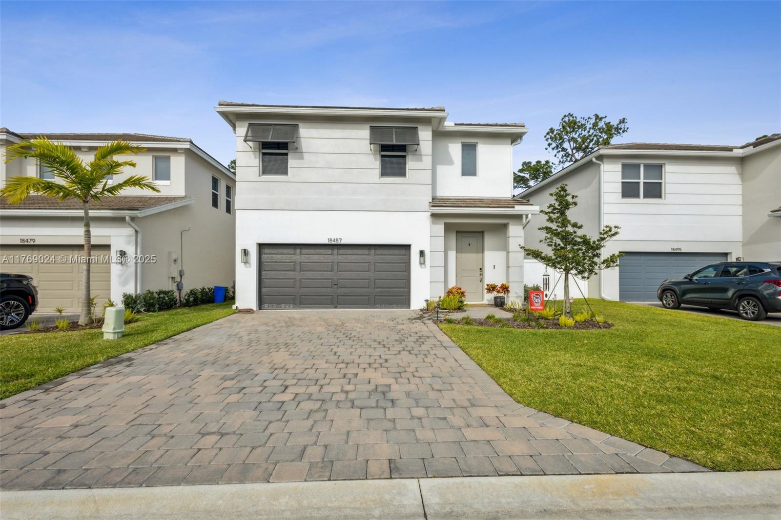 Welcome to your dream home in the prestigious Reserve at Jupiter by DR Horton—built in 2022 and move in ready. The home is a beautifully maintained 4-bedroom, 3-bathroom residence offering 2,528 square feet of elegant living space. This thoughtfully designed home features a spacious open layout, and abundant natural light, perfect for both relaxed family living and entertaining. Step outside to your private backyard oasis, complete with a sparkling pool, an outdoor kitchen, a custom putting green, and lush tropical landscaping. Ideally located in one of Jupiter’s most sought-after gated communities, this home offers luxury, comfort, and the South Florida lifestyle at its finest.