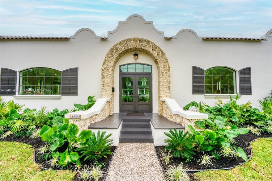 Step into timeless elegance with this meticulously renovated 1920 coral rock home, now a stunning Spanish revival that seamlessly blends historic charm with top-of-the-line modern amenities. The open floor plan invites you into a world of custom millwork, adorning the kitchen, bathrooms, laundry room, dining room, bar, living area & master walk-in closet. Embrace indoor-outdoor living with French doors connecting the master suite and living area to a lush back patio, overlooking a spacious pool. Sold fully furnished including pieces made exclusively for this home. All new electrical, HVAC, plumbing, roof, impact windows and doors, & more. Don't miss the opportunity to own a piece of history. Your dream home awaits in this Davis Harbor treasure.