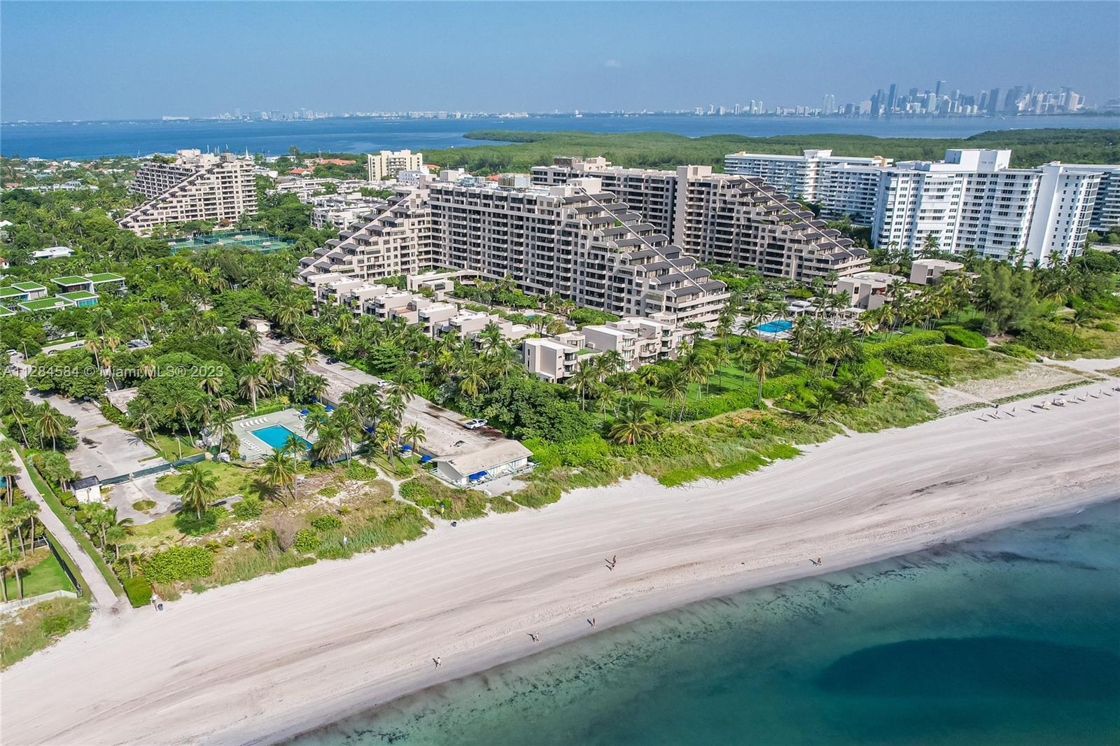 A SLOPE Unit = Entertainer's Paradise. With Spectacular Bay Views and the Iconic Miami Skyline. An Architectural designed floor plan with large extensive Bedroom dimensions, redone closets and tasteful finishes; This 3/3 plus Den/Office/4th bedroom And Extra Full Bathroom. A spacious corner location with a large deep wraparound terrace to dine Alfresco and watch the pristine sunsets. A Impact windows throughout with window treatments in Bdrms, Sound system included, 2 Assigned parking spaces (D-32, E-24). With Resort style amenities such as Guarded Gate, 24 hr Security, Concierge. Direct Beach access, Heated Pool & Jacuzzi, Gym, Golden Hog Market, Ceci's Spa, 12 Tennis courts, playground, Library, Party Rm, and more. (SLOPES RARELY COME TO THE MARKET). A Must see!! Priced to Sell.