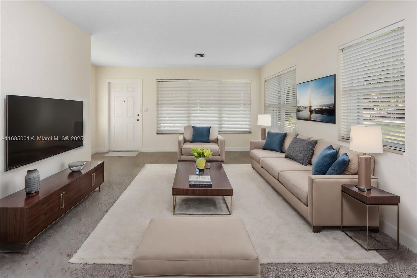 This spacious home just got even better with an incredible new price! 2-bedrooms, 2-baths with beautiful restored terrazzo flooring, impact windows AND accordion shutters! The primary is generously sized, providing ample space for relaxation and comfort. The kitchen features vinyl flooring, wood cabinets, granite counters, and a pantry for extra storage space! Step outside to enjoy the covered and screened patio, perfect for outdoor dining. Recent updates include newer electric panels, installed approximately 2 years ago, a carport completed with a new roof in 2023. A/C approx 5 years old, Water heater approx 5 years old. Located in the desirable Historic District, this home is just moments from Jefferson Park, beautiful beaches, I-95, and only 15 minutes from the airport.