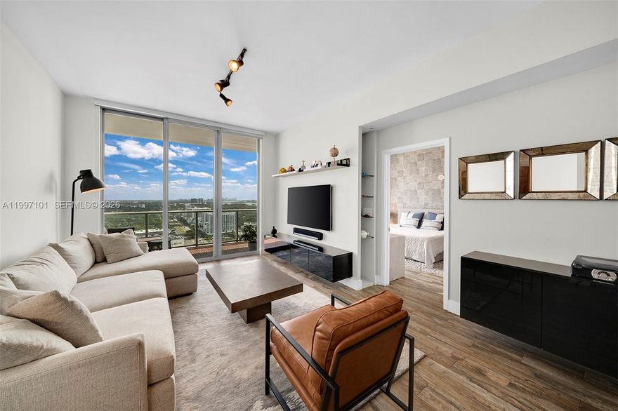 Discover this updated 1 BR / 1.5 BA residence in the heart of Midtown Miami. Thoughtfully enhanced with upgraded flooring, custom built-ins, and beautifully renovated bathrooms, the residence offers a clean, modern finish that stands apart from typical inventory. Positioned on a high floor, the unit captures sweeping city and bay views from an oversized private terrace—ideal for both morning light and evening unwind. Residents enjoy access to a well-appointed fitness center and resort-style pool, all within Midtown’s vibrant, walkable core—surrounded by some of Miami’s best retail, dining, cafés, and everyday conveniences just steps from your door. (One parking space included | Washer/Dryer in unit).