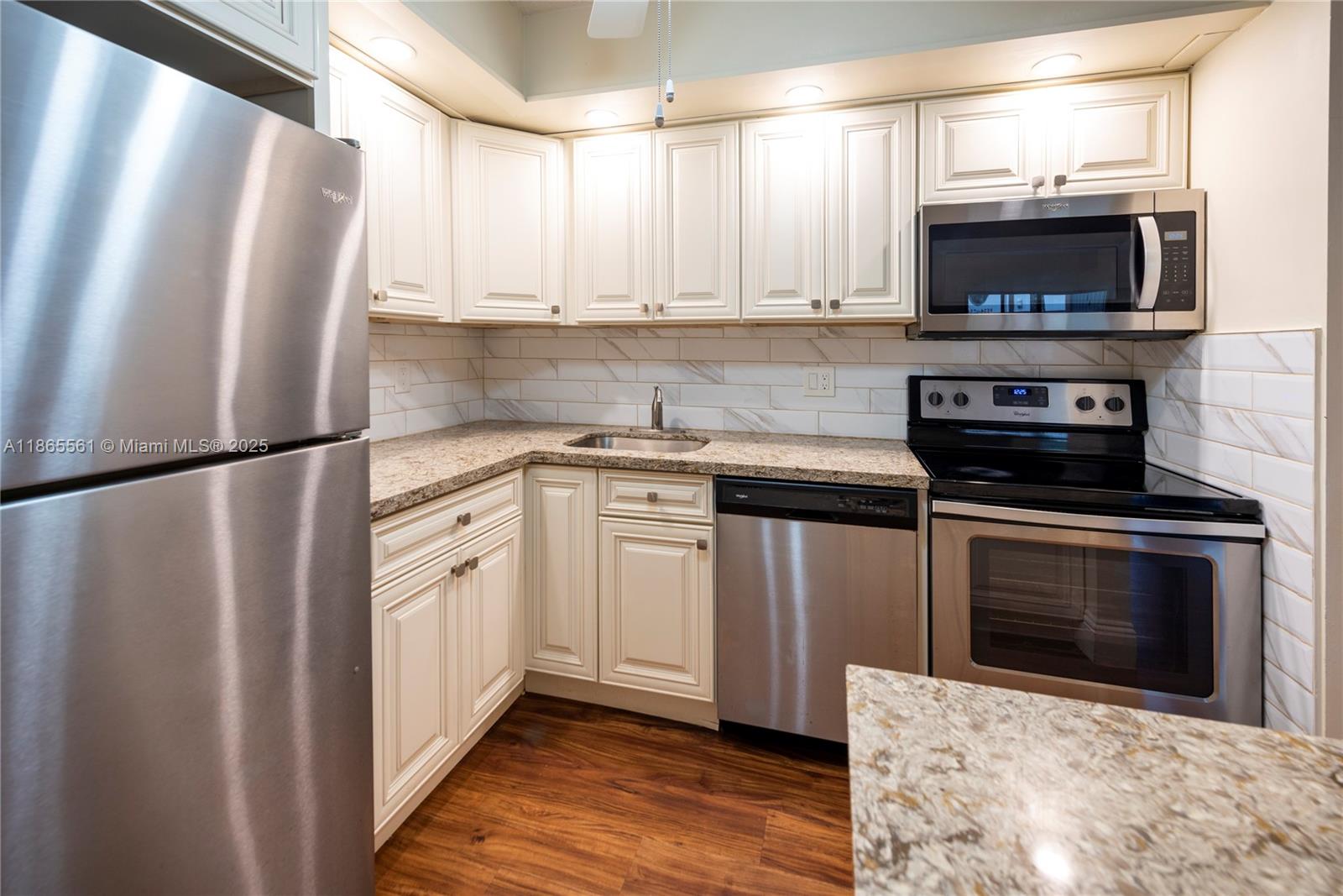 Impeccable 2 bed, 2 bath with convertible den garden apartment—the largest model in the sought-after Belfort community at Kings Point, Tamarac. This upgraded unit features wood kitchen cabinets, granite countertops, stainless steel appliances, and a matching vanity in the main bath. Enjoy open-concept living with new vinyl flooring, a new A/C, and water heater. Residents benefit from premium amenities, including cable with HBO, Showtime, movie channels, and high-speed internet.