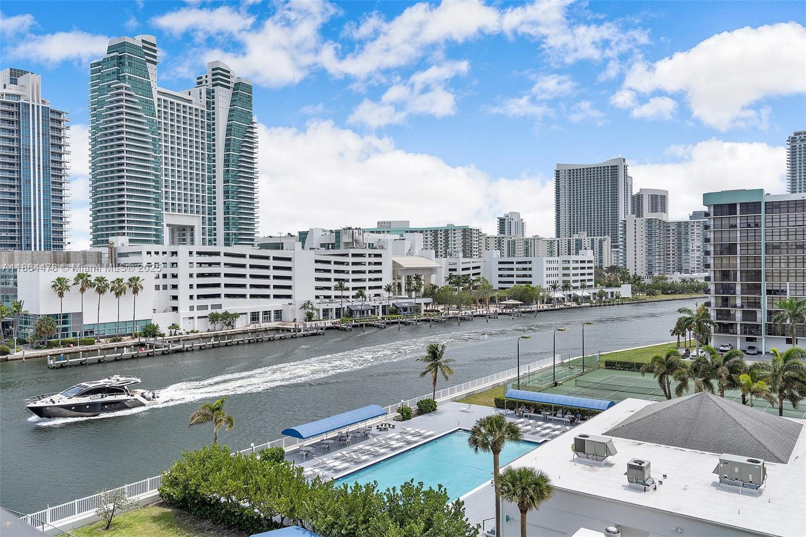 Spacious and freshly painted unit with brand-new A/C is move-in ready! Enjoy a smart floor plan with lots of natural light, a versatile den (perfect as an office or second bedroom), and a private balcony. Resort-style living includes a heated waterfront pool, fitness center, tennis courts, sauna, and 24-hour security. Just minutes drive from the beach, shopping, dining. Call the listing agent to see.