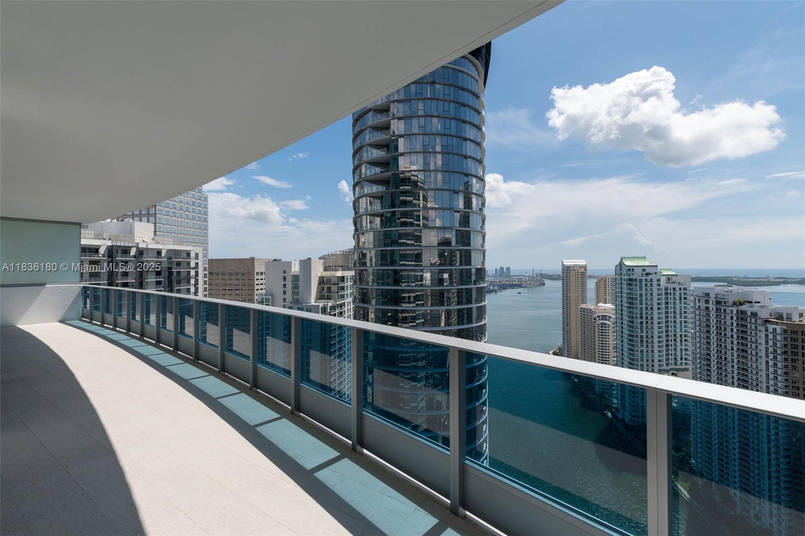 Spectacular view from this almost never used condo in the 46 floor. Experience upscale living in this stunning 2 bed / 2.5 bath unit plus den plus office, 2 ASSIGNED PARKING and storage, featuring soaring 11-foot ceilings. The split floor plan offers spacious bedrooms and a luxurious master bath. Enjoy breathtaking views of the Miami River, Fisher Island, Brickell Key, and South of Fifth from this high-rise haven. Gourmet kitchen equipped with premium Sub-Zero and Miele appliances. Indulge in on-site fine dining at Zuma, relax by multiple resort-style pools, or unwind at the spa located on the 16th floor. Professionally furniture.
