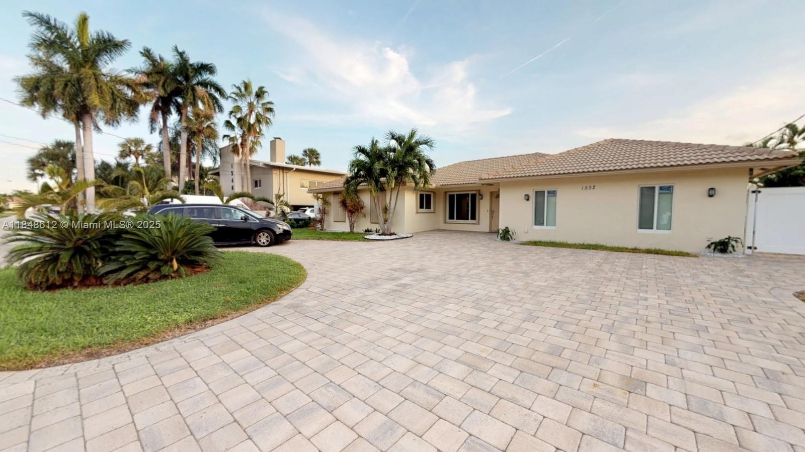 Experience the ultimate South Florida lifestyle at 1532 SE 9th St, Deerfield Beach—a modern 5-bedroom, 4-bath single-family home with approx. 2,450 sq ft of living space, featuring a private pool and 80-foot yacht dock with boat lift, bumpers, cleats, Shore Power Pedestal, and water supply. This waterfront sanctuary offers direct ocean access with no fixed bridges, ideal for yachting enthusiasts and entertainers alike. Enjoy resort-style outdoor living just minutes from both Hillsboro and Boca inlets, Mizner Park, and walk or golf cart to the beach, shopping, and dining—this is coastal living at its finest!