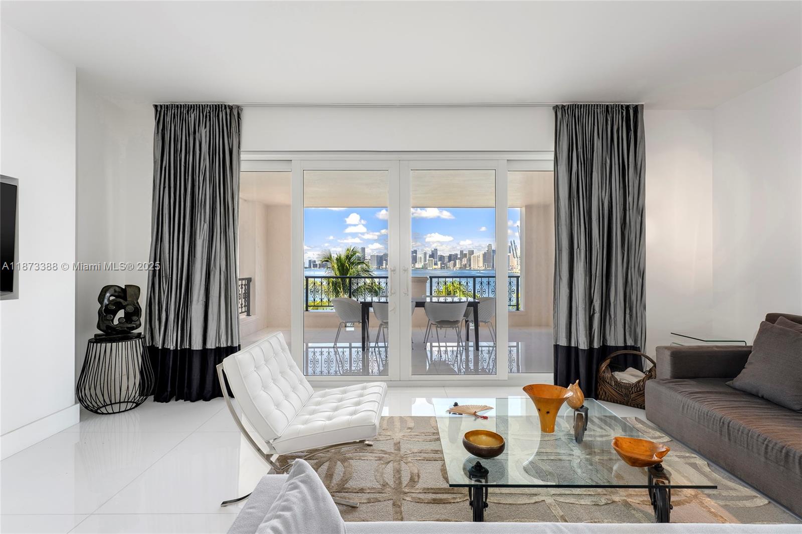 This contemporary unit in the coveted Bayview section is being sold furnished. Offers 3BR/3BA, & 1,950 SF of well-proportioned interiors, plus two terraces including a private entry & large bayside terrace w/Biscayne Bay, Miami skyline & sunset views. Large-slab porcelain floors in common areas flow seamlessly to the bayside terrace, & bedrooms feature ceramic trompe l'oeil floors. Elegant flow-through living & dining layout opens directly to the bayside terrace w/direct bay views. Chef’s kitchen sports Miele & Sub-Zero appliances, & custom cabinetry. The spacious bayside principal suite has a seating area, terrace access, designer wall unit & spa-inspired bath w/soaking tub, rain & steam shower, & custom closets. Guest BR w/en-suite bath, third BR/study with full bath across the hallway.