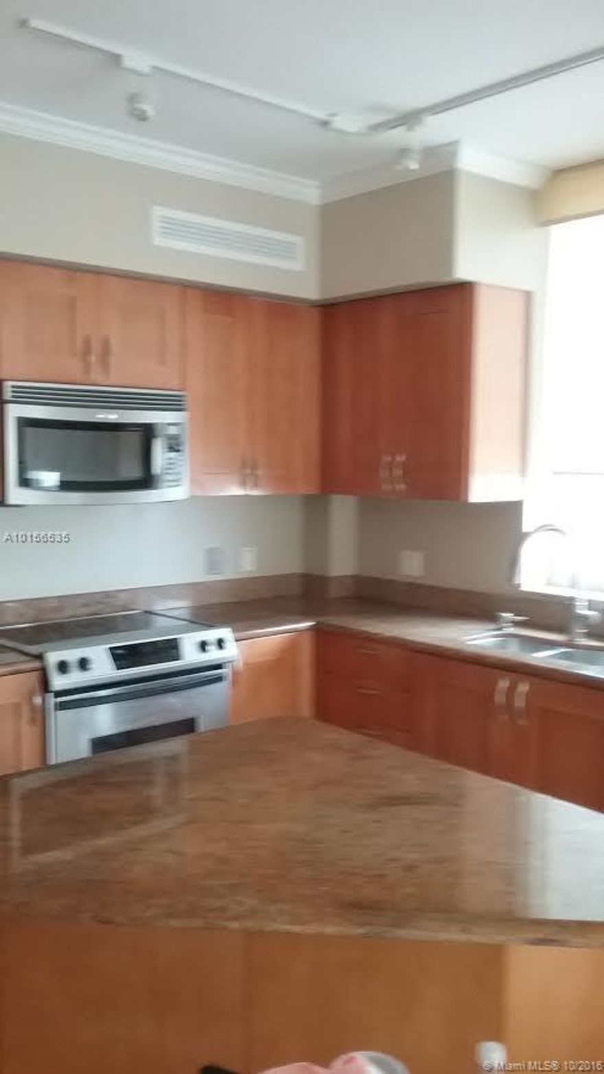 BEAUTIFUL CORNER UNIT WITH WRAP AROUND BALCONY...LARGEST 2 BED FLOOR PLAN IN THE BUILDING...HUGE TERRACE WITH GOLF, CITY AND OCEAN VIEWS. MARBLE AND LUXURY LAMINATED FLOORS. HIS AND HERS DESIGNER CLOSETS..SUNKEN TUB AND HUGE SHOWER IN MASTER BATH. 2 COVERED PARKING SPACES. TOP OF THE LINE AMENITIES AND MUCH MORE.