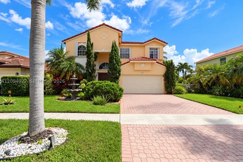 Photo of 1021 NW 185th Ave, Pembroke Pines, FL 33029 (MLS # A12094927)