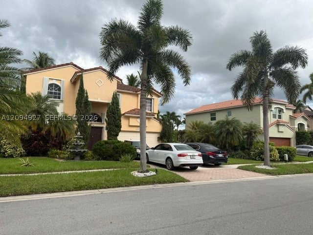 Photo of 1021 NW 185th Ave, Pembroke Pines, FL 33029 (MLS # A12094927)
