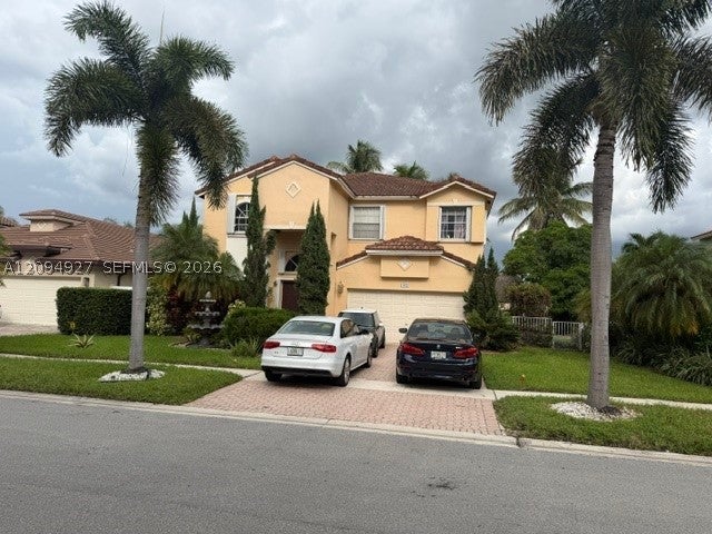 Photo of 1021 NW 185th Ave, Pembroke Pines, FL 33029 (MLS # A12094927)