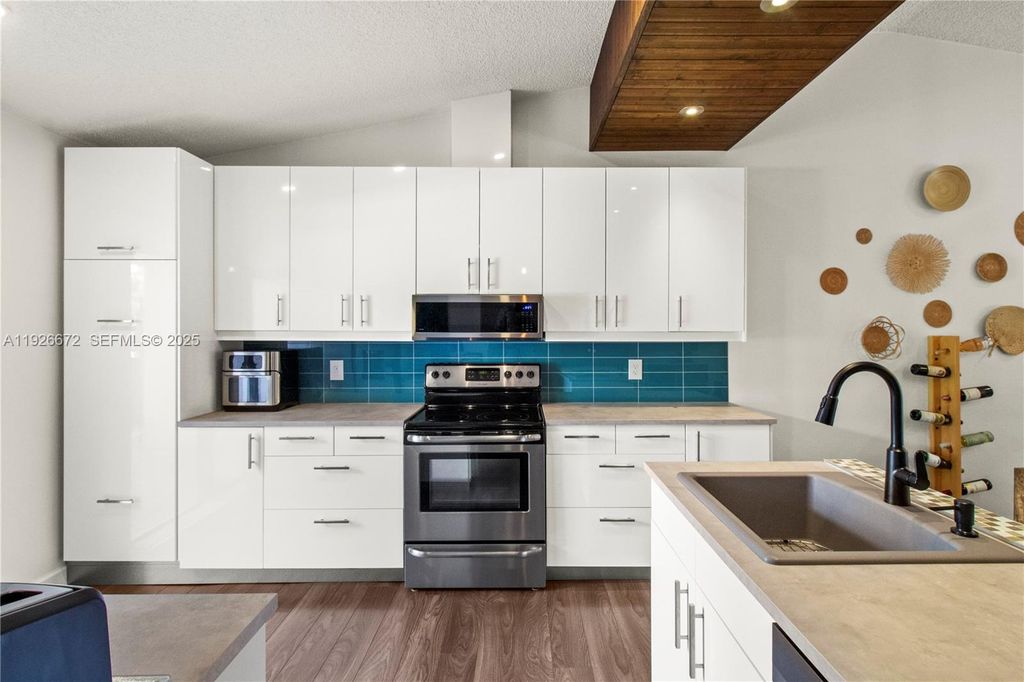 Photo of 1056 E Lakes Dr, Deerfield Beach, FL 33064 (MLS # A11926672)